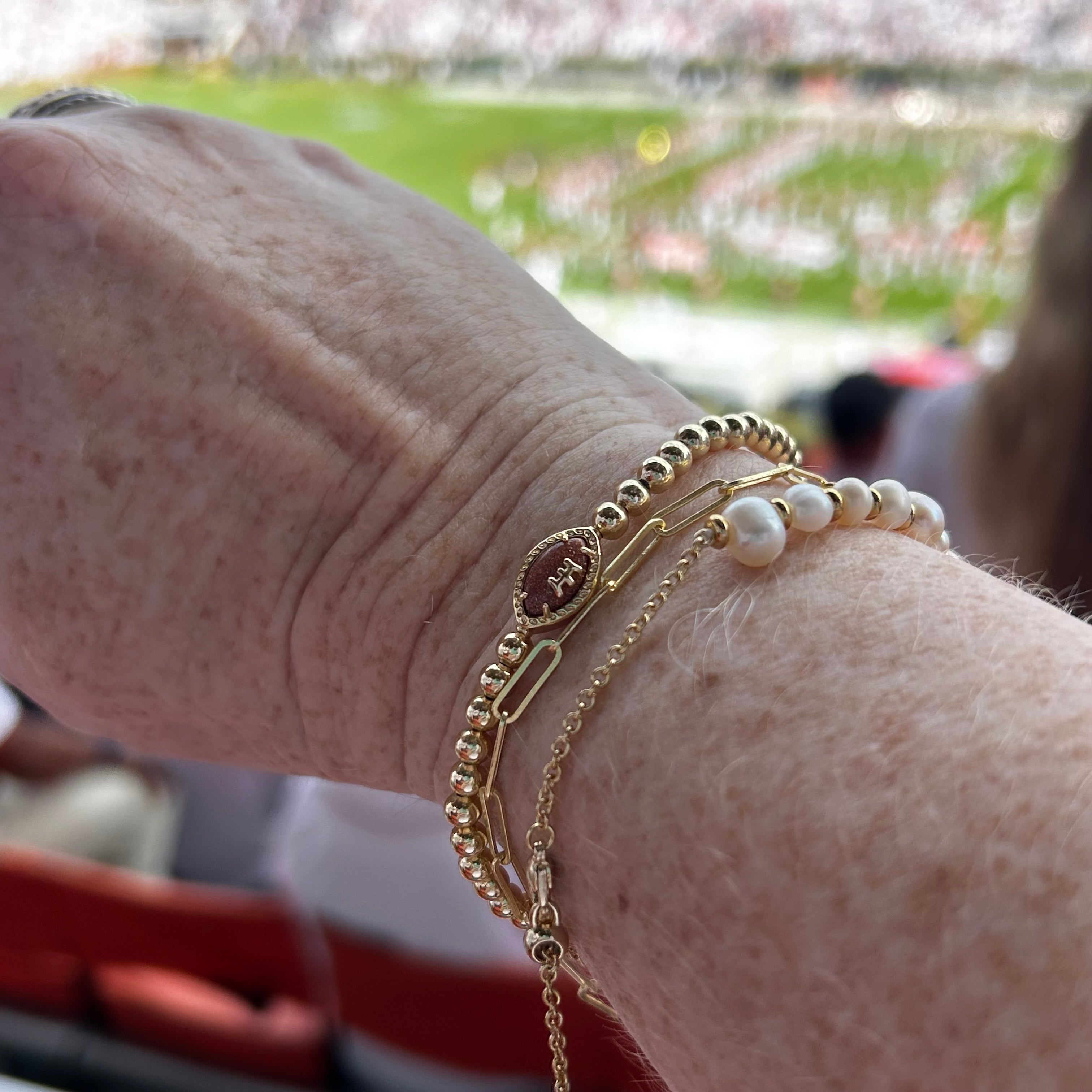 Football Gold Stretch Bracelet in Orange Goldstone